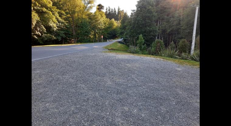 Parking off side of road, gravel surface no protection from road traffic.