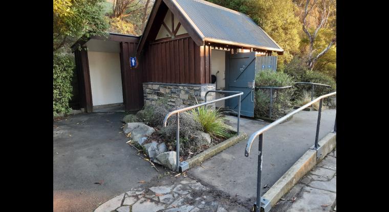 Ramp and handrail leading up to facility.